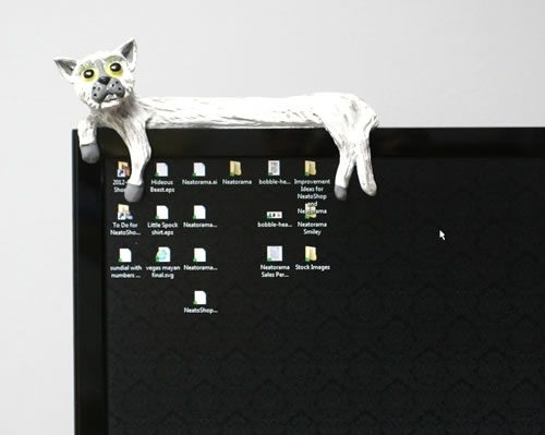 https://static.neatorama.com/images/2012-03/longcat-monitor-sitter.jpg